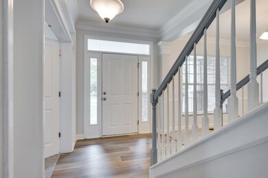 Bright, welcoming entry with fresh paint and new flooring!