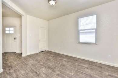 Empty room with baseboards and wood finished floo