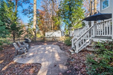 Fenced in back yard with shed on corner lot.