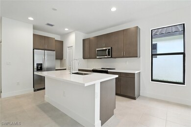Kitchen featuring appliances with stainless steel