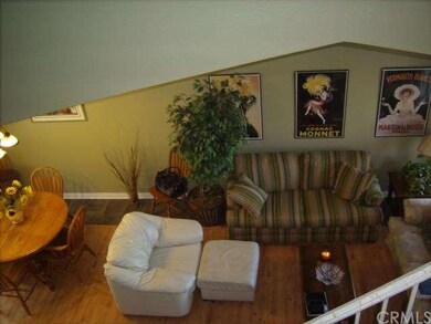 Living room opens to formal dining.