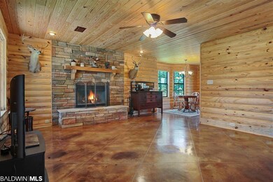 Living area featuring wood burning fireplace