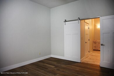 TownhouseWhiteMasterTowardBath