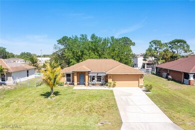 Ranch-style home with fence, an attached garage, s