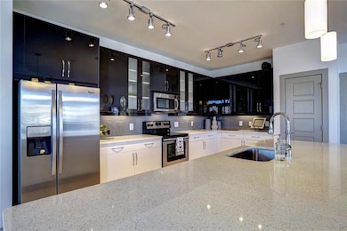 Kitchen featuring tasteful backsplash, stainless s