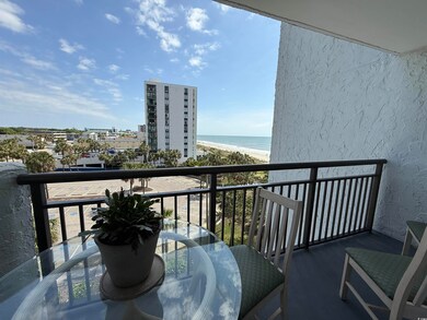 Balcony featuring outdoor dining area and a water 