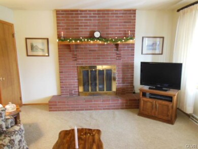 Living room, 17 x 13, brick fireplace with propane