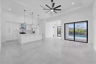 Unfurnished living room with a high ceiling, a cei
