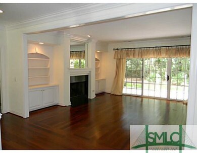 Living Room. Features hardwood floors, built in ca