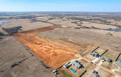 Birds eye view of property featuring a rural view