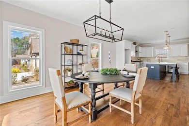 Dining area with baseboards, a wealth of natural l