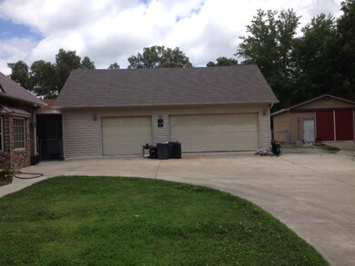 Large 3 car detached garage and a large metal garage/workshop more storage has been added to the detached garage.