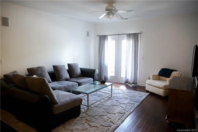 large living room opens to covered porch