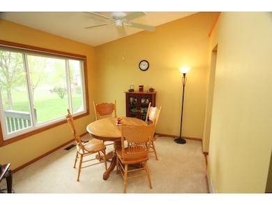 Dining Room faces west and view of trees. Vaulted 