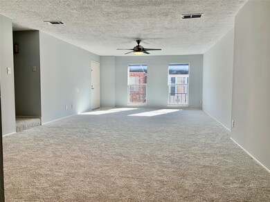 Another view of the expansive living space looking