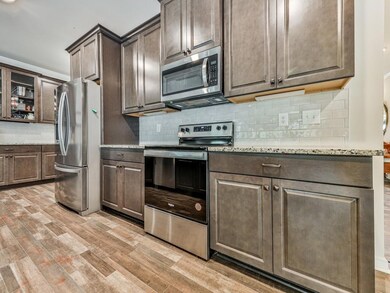 Kitchen featuring appliances with stainless steel 