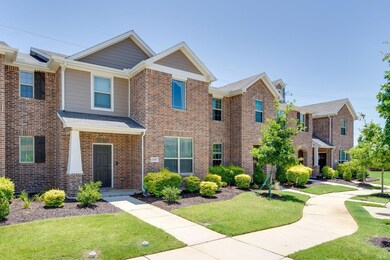 View of front of property with brick siding and a front lawn