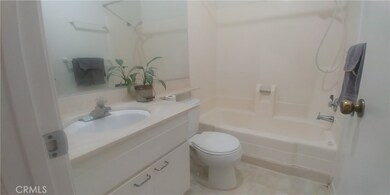 Hall bath with shower in tub area.
