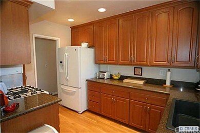 Remodeled Kitchen With Custom Cabinets & Lights.