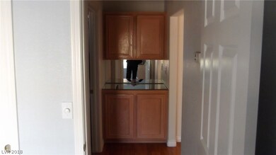 CABINETS BY 2ND BATHROOM. OUTSIDE OF 2ND BEDROOM.