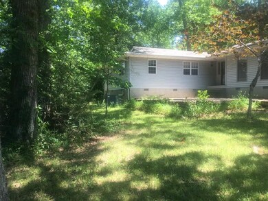 Nestled in a park like setting. The road is not visible from the home.