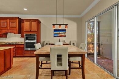 Dining room featuring ornamental molding, recessed