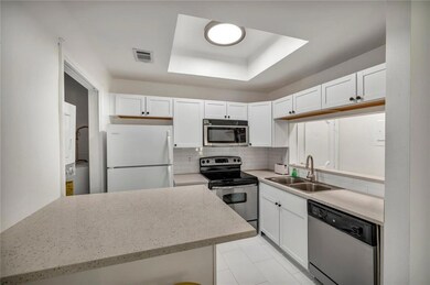 Kitchen featuring stainless steel appliances, a s