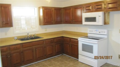 Eat in kitchen with beautiful knotty pine cabinets