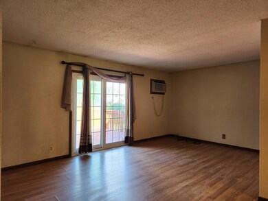 The living room has a walkout patio door over looking the gorgeous backyard!