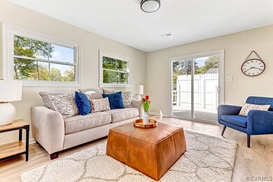 Living room with hardwood / wood-style flooring