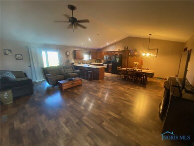 Open floor-plan with peaked ceilings