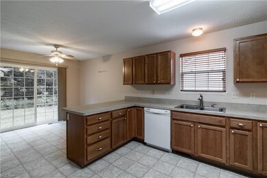Kitchen opens to patio and wooded lot.   Great for