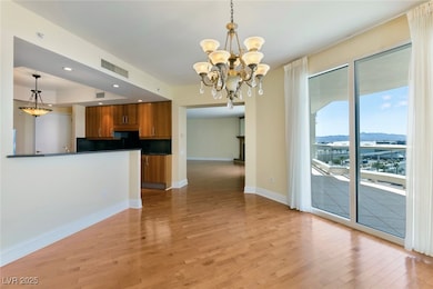 Kitchen featuring brown cabinetry, dark countertop