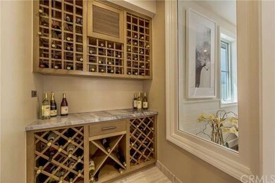 Refrigerated wine room across from dining room