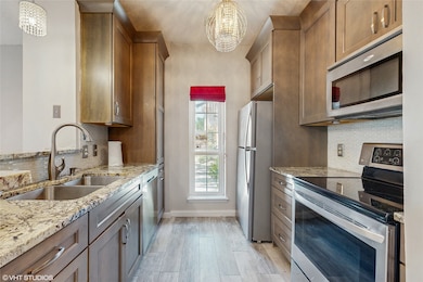 This is a charming townhouse with a brick exterior