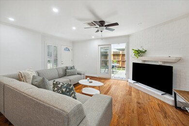 Living room features wood burning fireplace / TV c
