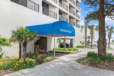 View of building exterior featuring a carport