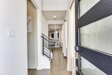 Entrance foyer featuring stairs, wood finished fl
