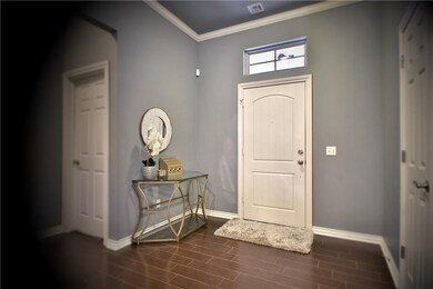 Front foyer with coat closet on the right and hall