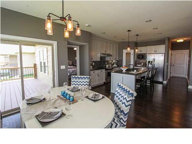 Kitchen Dining leads to composite deck from low E 