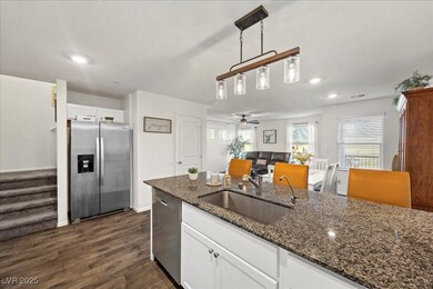 Kitchen with breakfast bar and granite countertops.