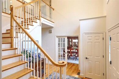 Front Entry with curved staircase to the 2nd level