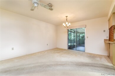Dining Area with sliders leading to screened lanai