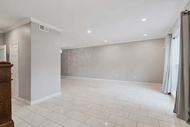 Bright dining area with neutral tones and sleek ti
