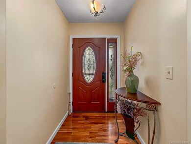 Charming entry foyer with cherry stained hardwood 