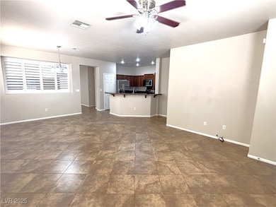 Unfurnished living room with a ceiling fan and a c