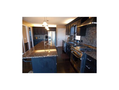 Gas Stove w/ vented range hood.