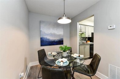 Dining area with light wood-type flooring