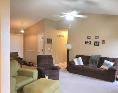 Great Room showing Ceiling Fan, Foyer Coat Closet 