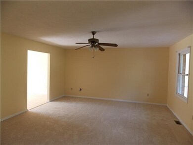 Living Room. Brand new carpet and all freshly pain
